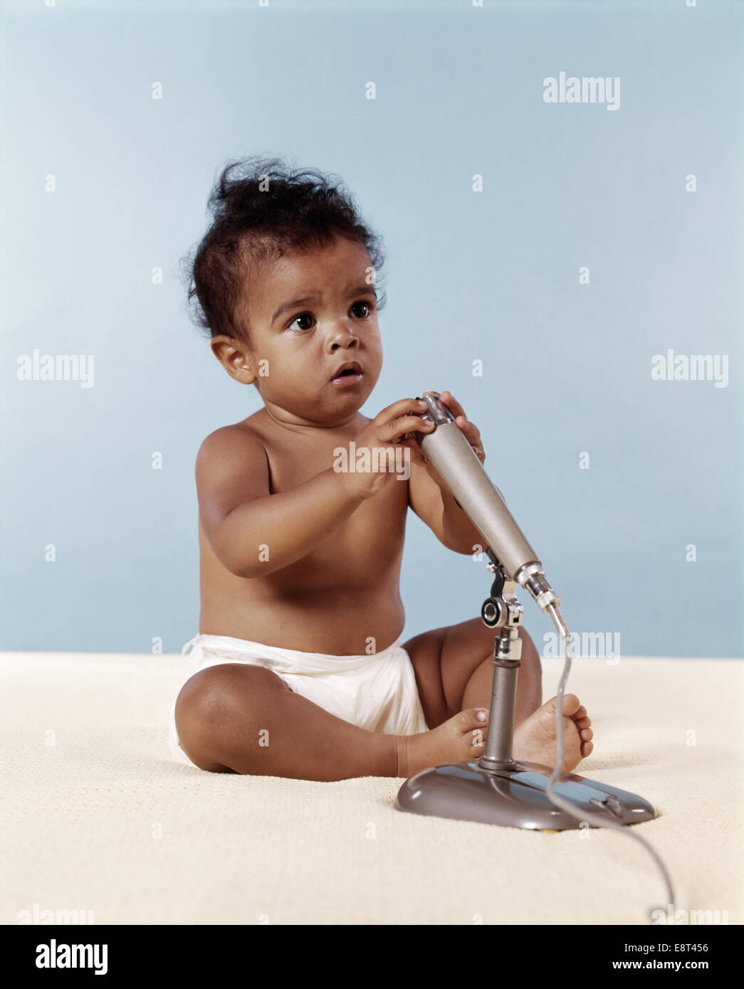 1970s AFRICAN AMERICAN BABY WITH MICROPHONE Stock Photo - Alamy