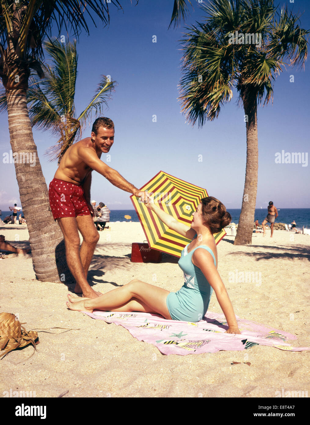 1960s 1950s COUPLE ON TROPICAL BEACH Stock Photo