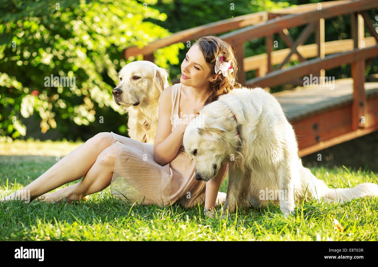 Attractive lady with two dogs Stock Photo