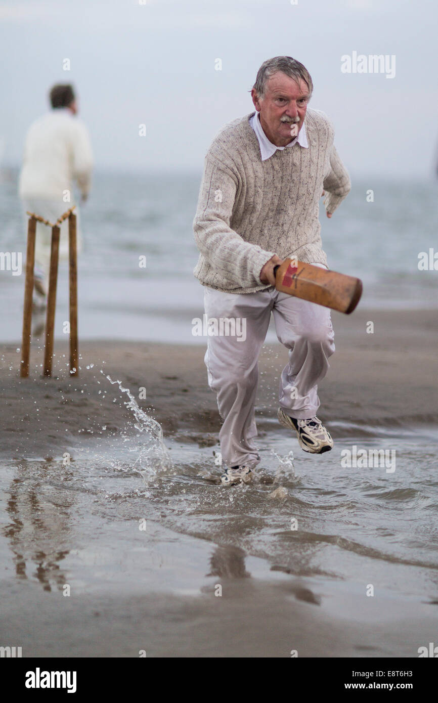 Action during the annual Brambles cricket match between members of the Island Sailing Club and the Royal Southern Yacht Club on Stock Photo