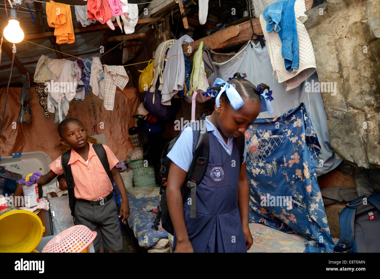 Brother and sister in school uniforms, Camp Icare for earthquake refugees, Fort National, Port-au-Prince, Haiti Stock Photo