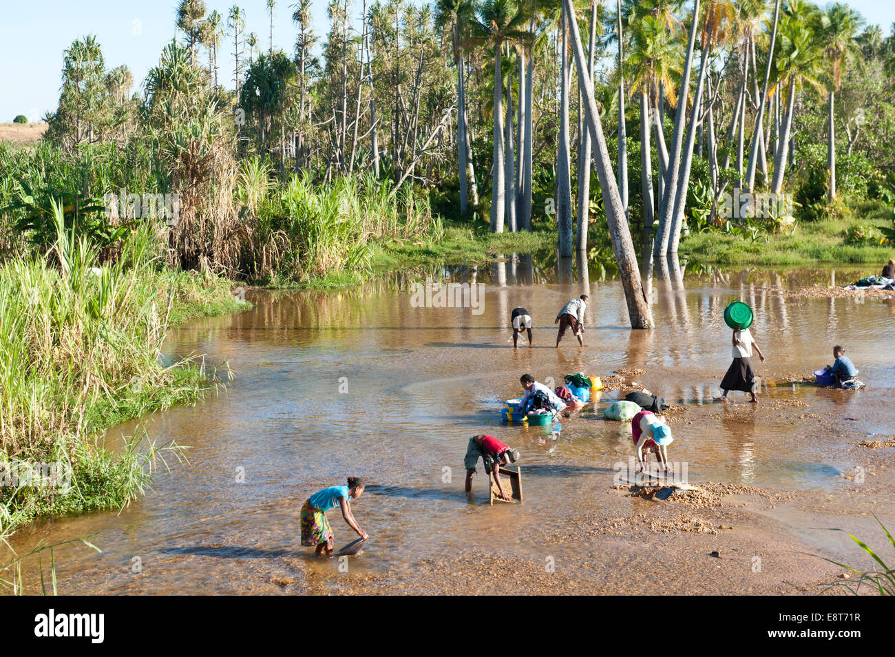 Digging for sapphires, treasures of the soil, people with sieves panning in the river, Ilakaka, Madagascar Stock Photo