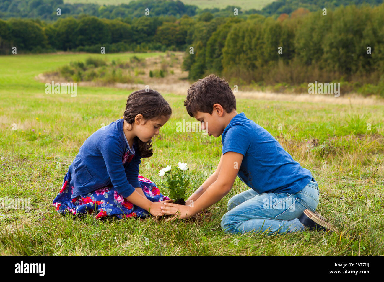 Kids gardening in park Stock Photo