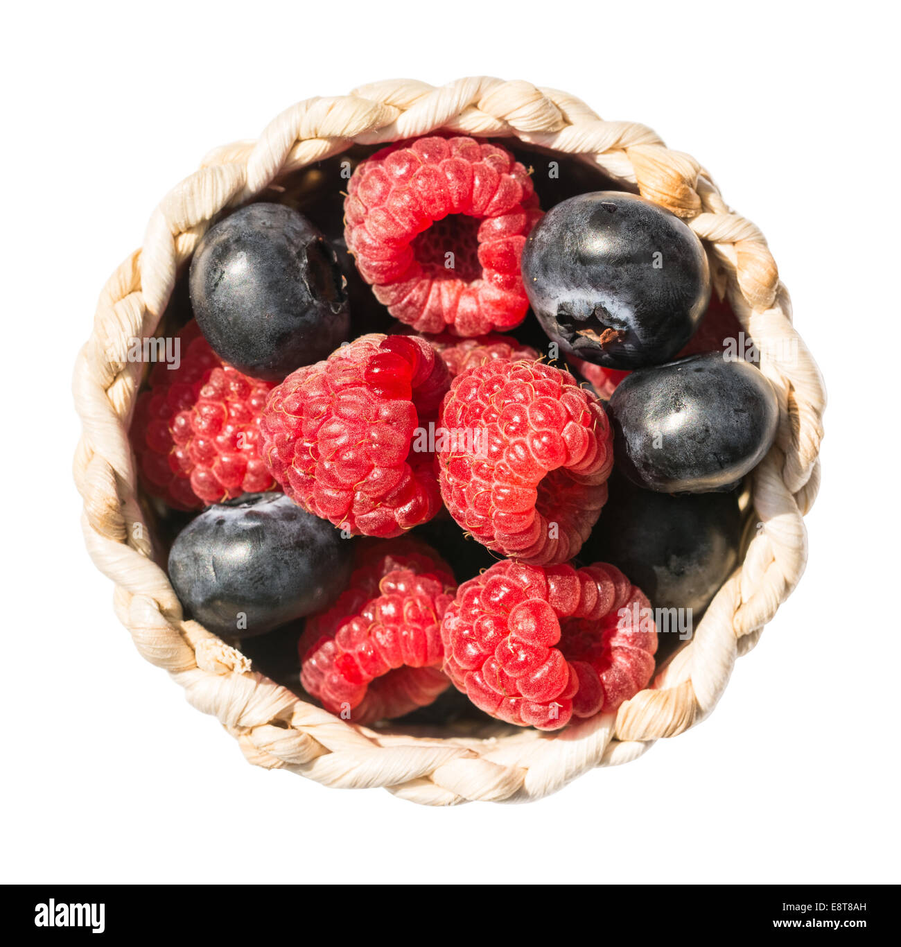 Raspberries And Blueberries In Basket Isolated Stock Photo