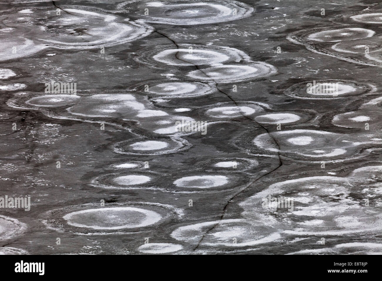 Crack in an ice surface with annular structures, Switzerland Stock Photo
