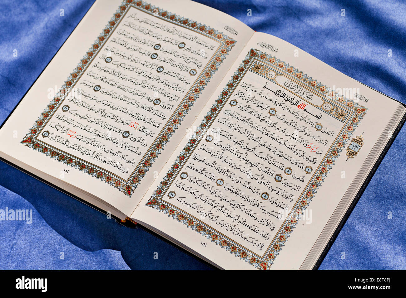 Opened Koran in Arabic script Stock Photo