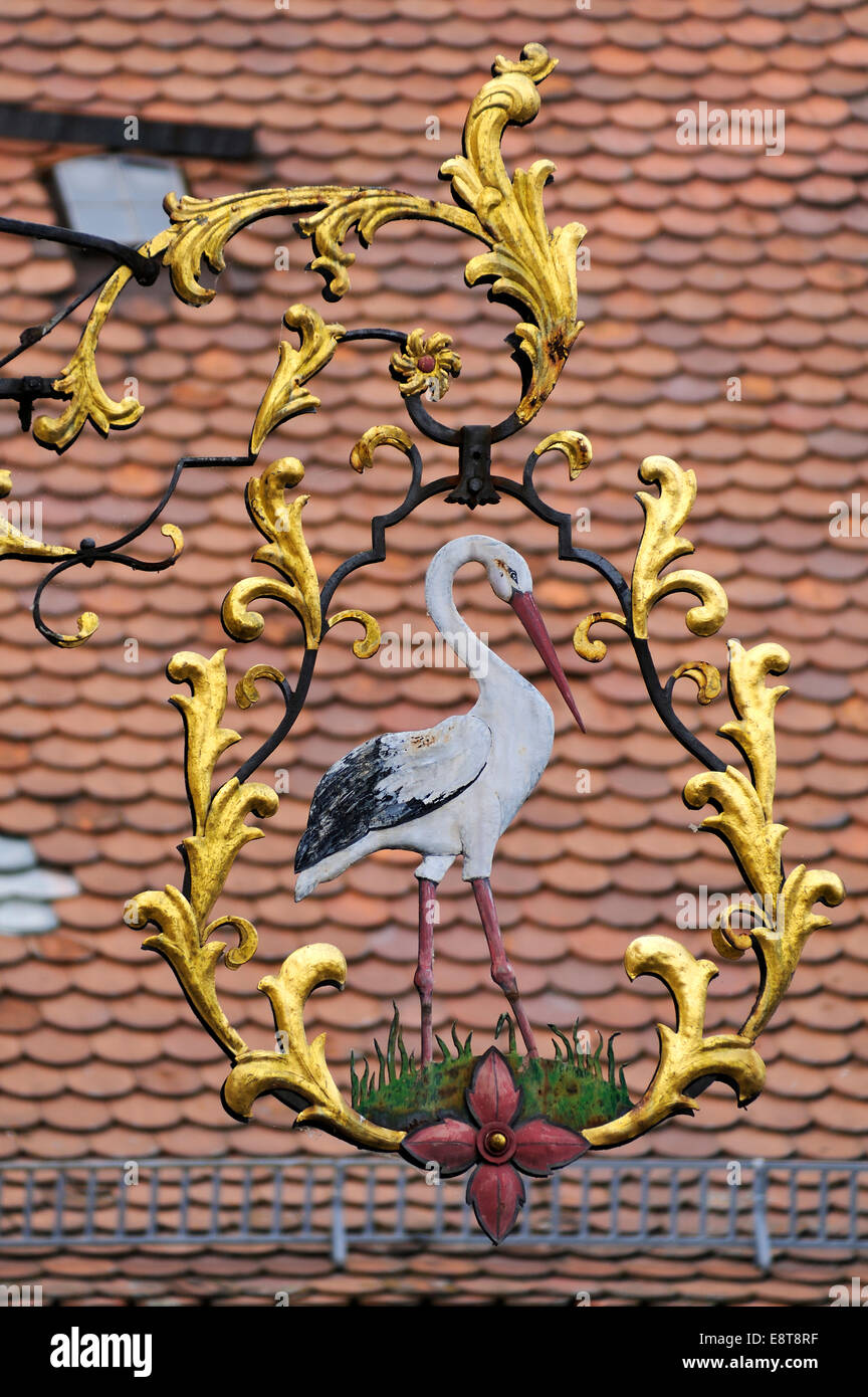 Hanging sign of the 'Zum Storchen' restaurant, inn since about 1580, Bad Windsheim, Middle Franconia, Bavaria, Germany Stock Photo