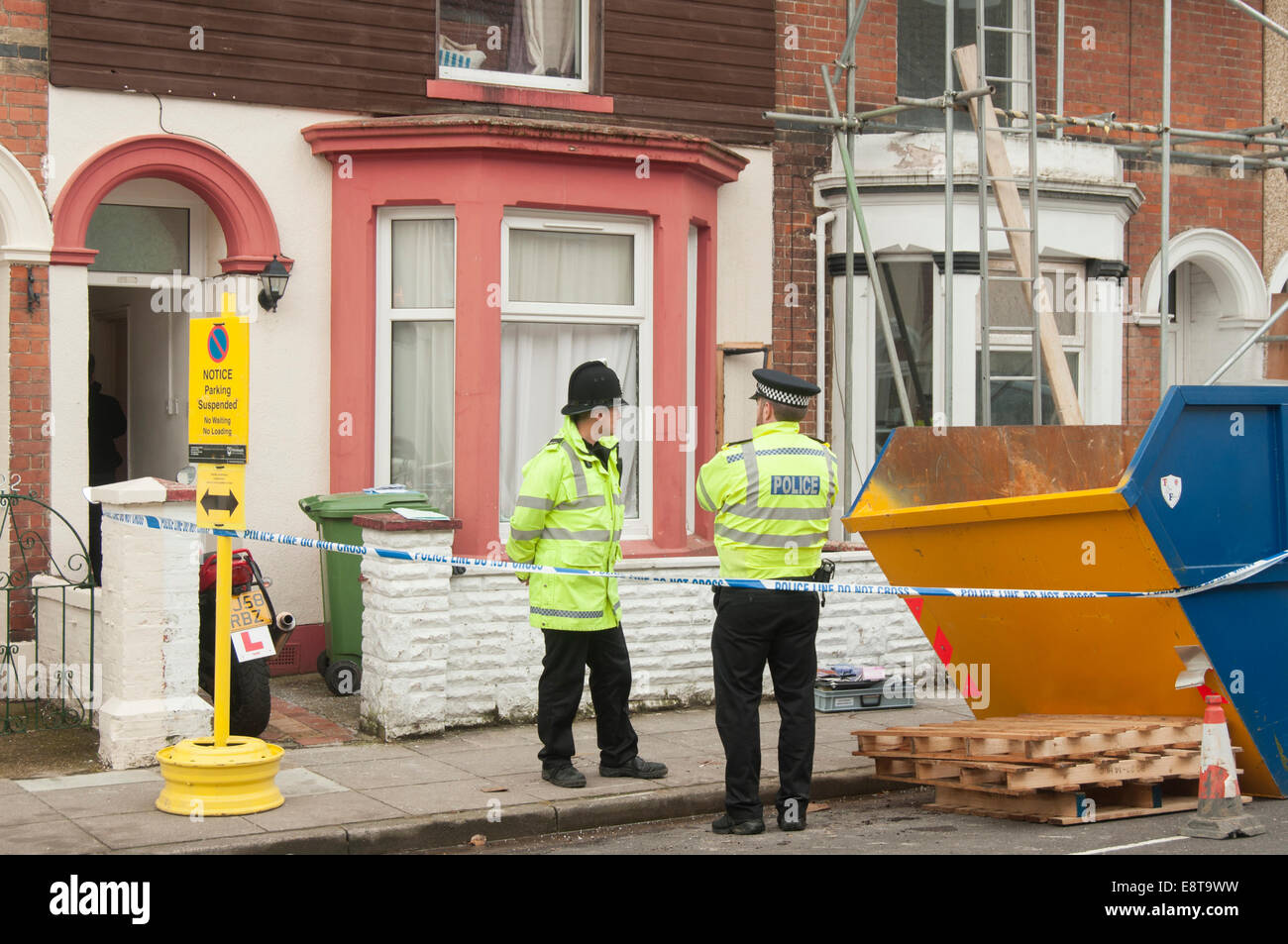 Portsmouth, UK. 14th Oct, 2014. Police stand outside a terraced house in Hudson Road, Southsea, Portsmouth, Hampshire, after six people were arrested on suspicion of terrorism offences, 14th Oct 2014. Credit:  Rob Wilkinson/Alamy Live News Stock Photo