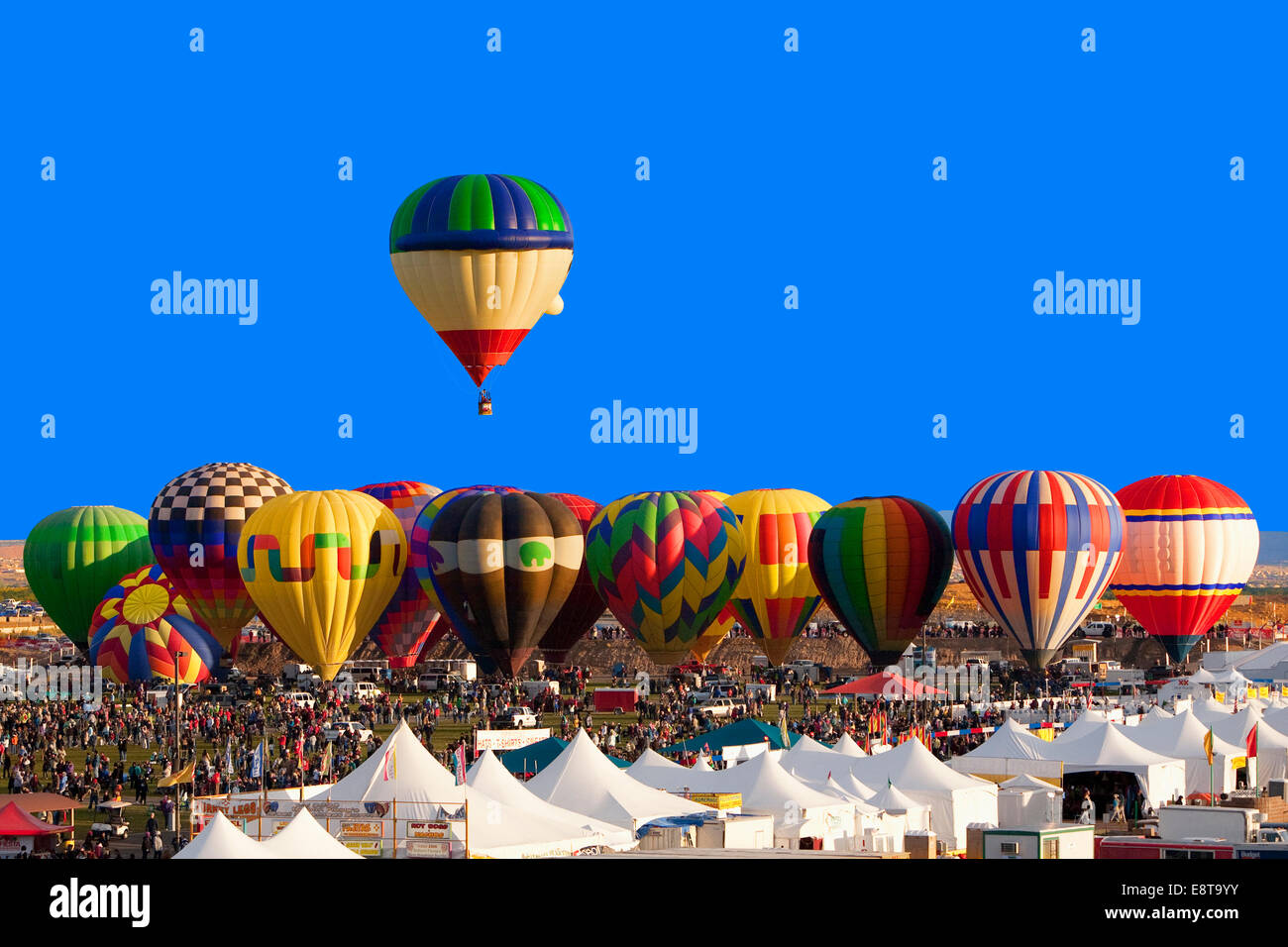 Hot air balloon floating above others at festival, Albuquerque, New Mexico, United States Stock Photo