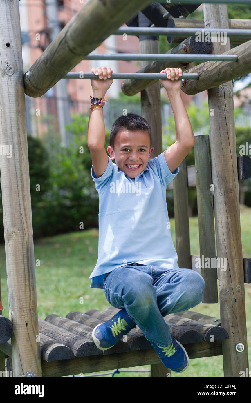 Hispanic boy playing at playground Stock Photo