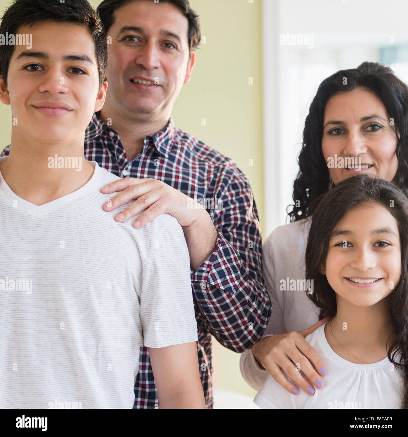 Hispanic family smiling Stock Photo
