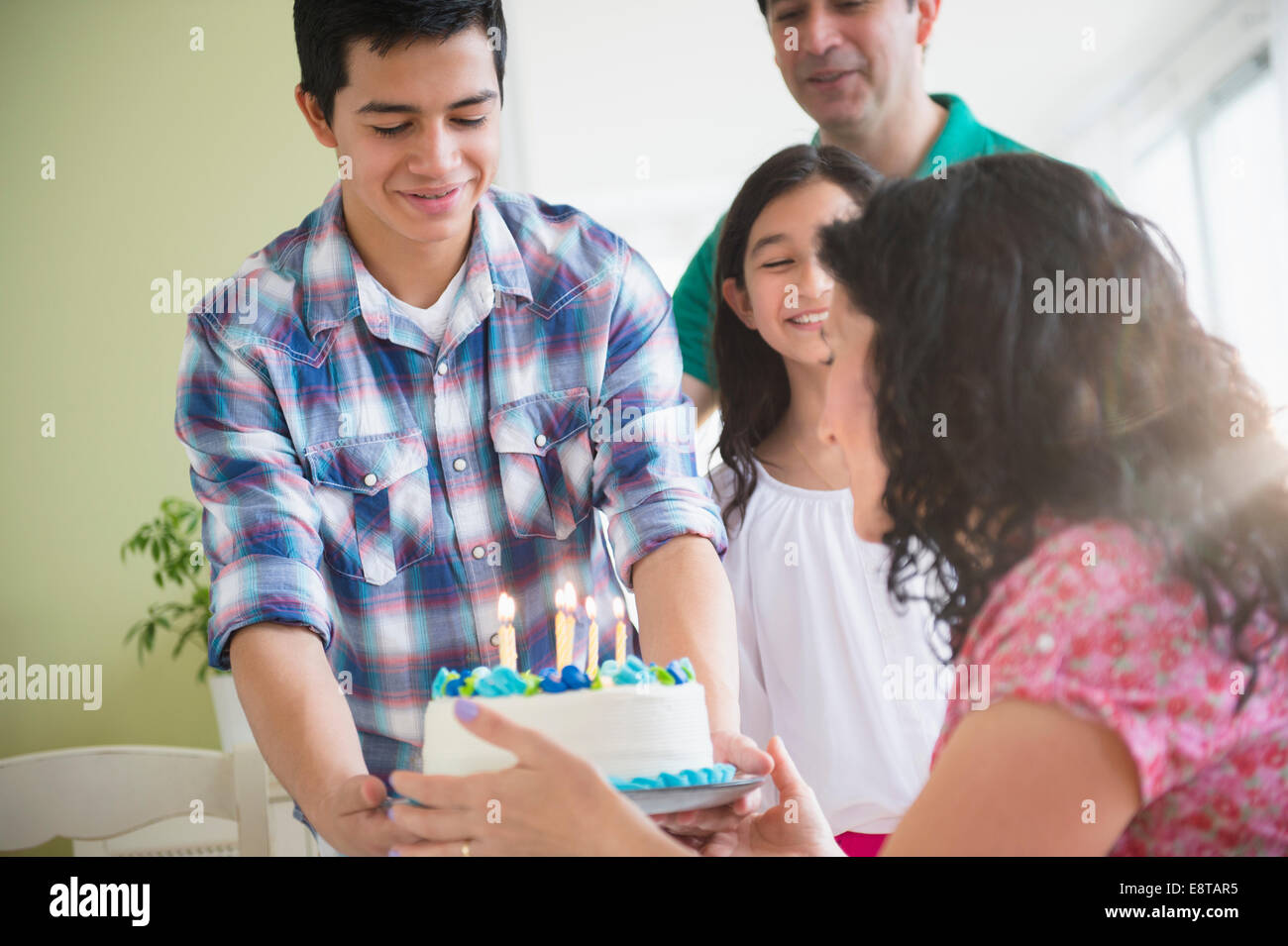 Hispanic family celebrating birthday together Stock Photo