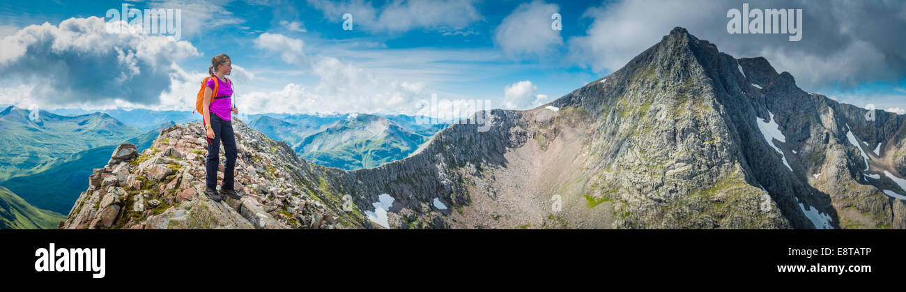 Caucasian girl hiking on rocky mountain Stock Photo - Alamy