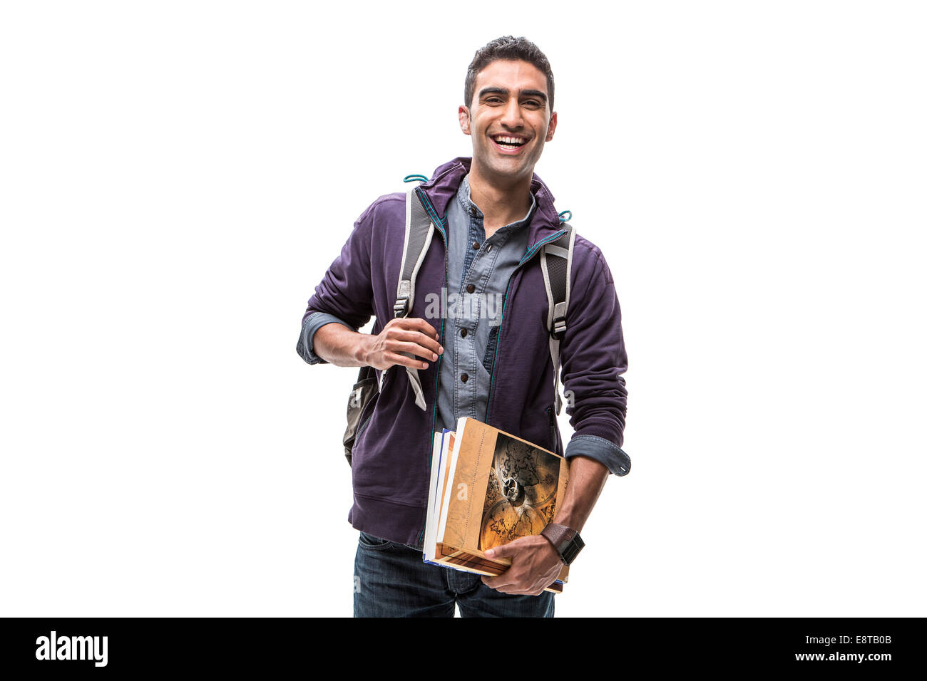 Indian student carrying books and backpack Stock Photo