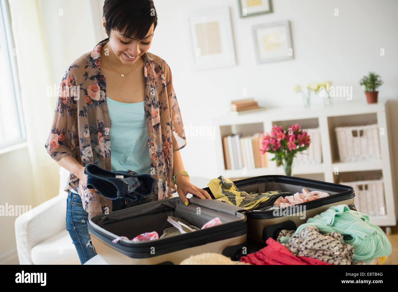 Packing suitcase at home with woman items, accessories, Stock image