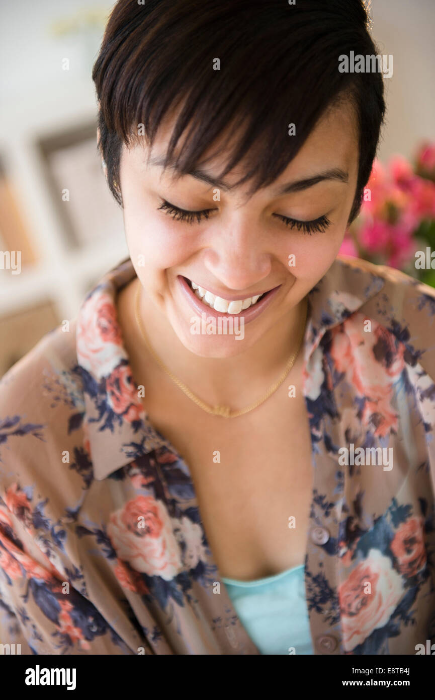 Close up of mixed race woman's smiling face Stock Photo