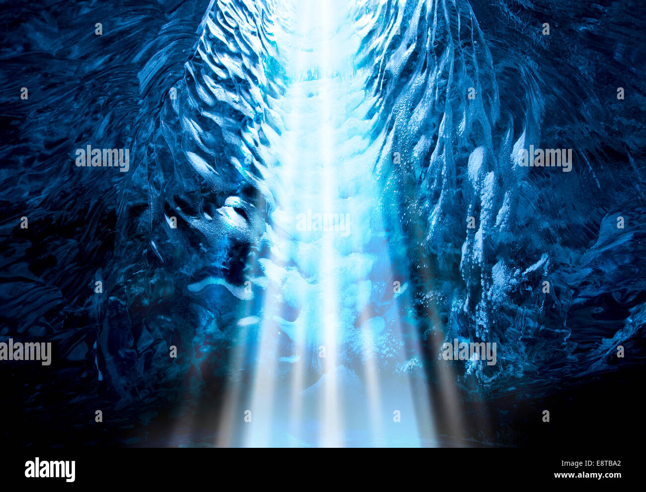 Light shining into ice cave Stock Photo