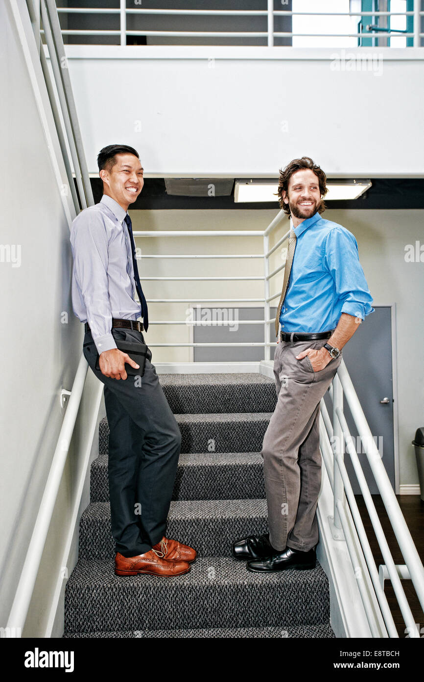 Two businessmen standing side by side hi-res stock photography and ...