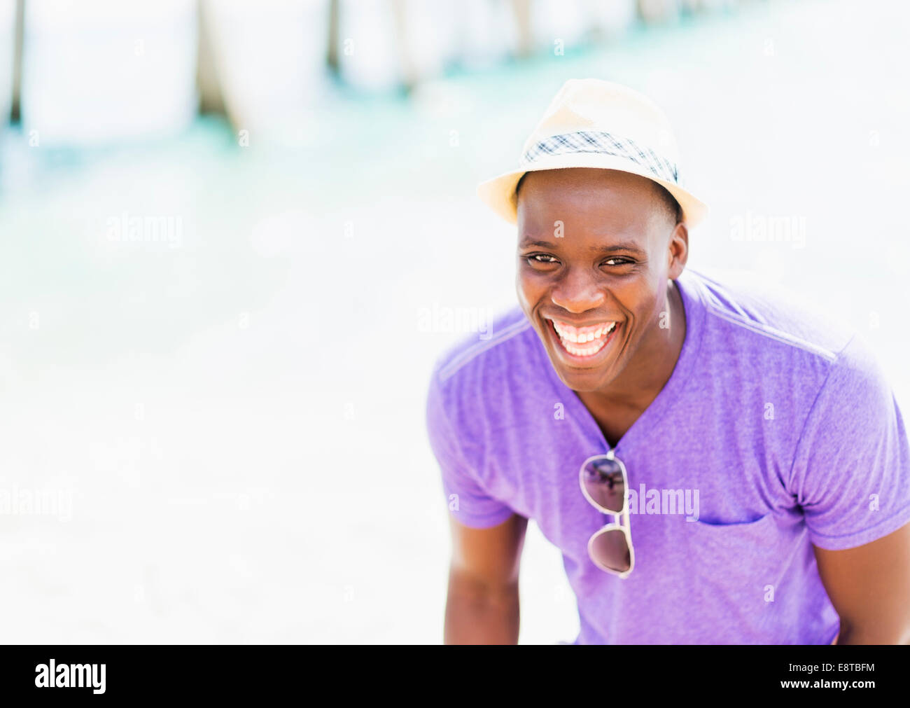 Mixed race man at beach Stock Photo - Alamy