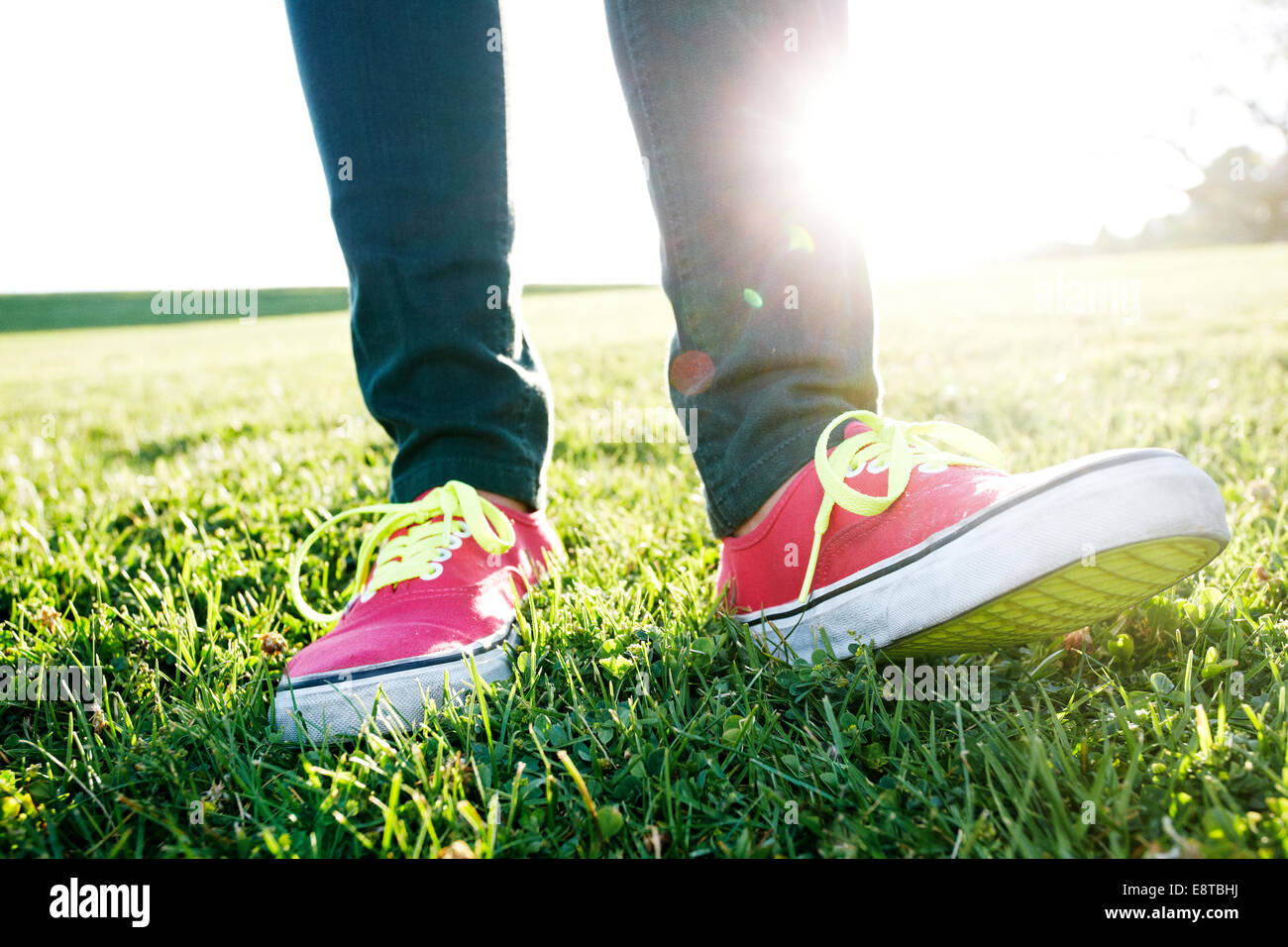 Close up of Hispanic woman's sneakers Stock Photo