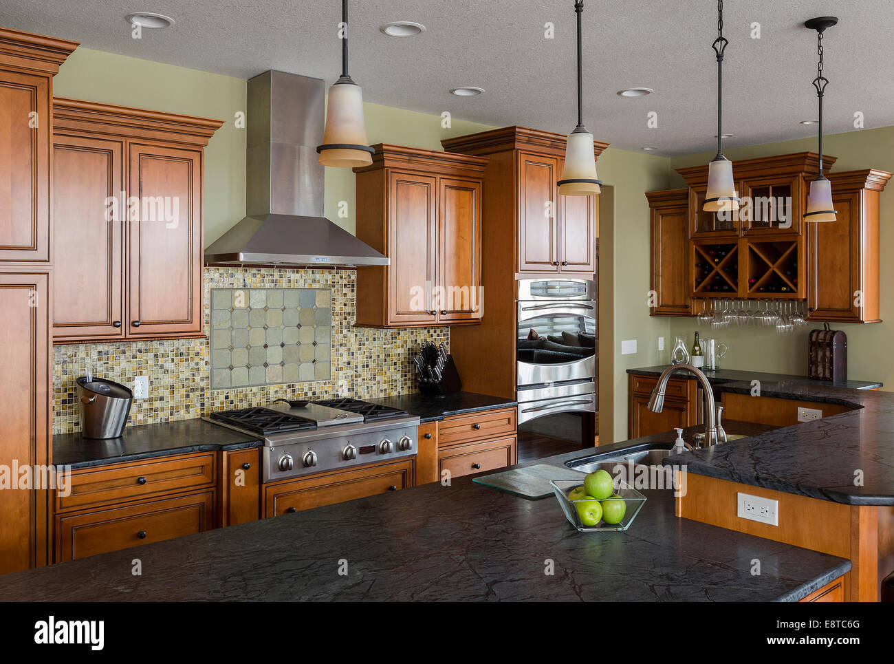 Tile back splash and island in kitchen Stock Photo