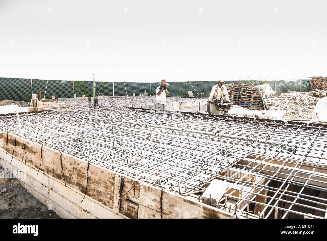 Hispanic construction workers at construction site Stock Photo