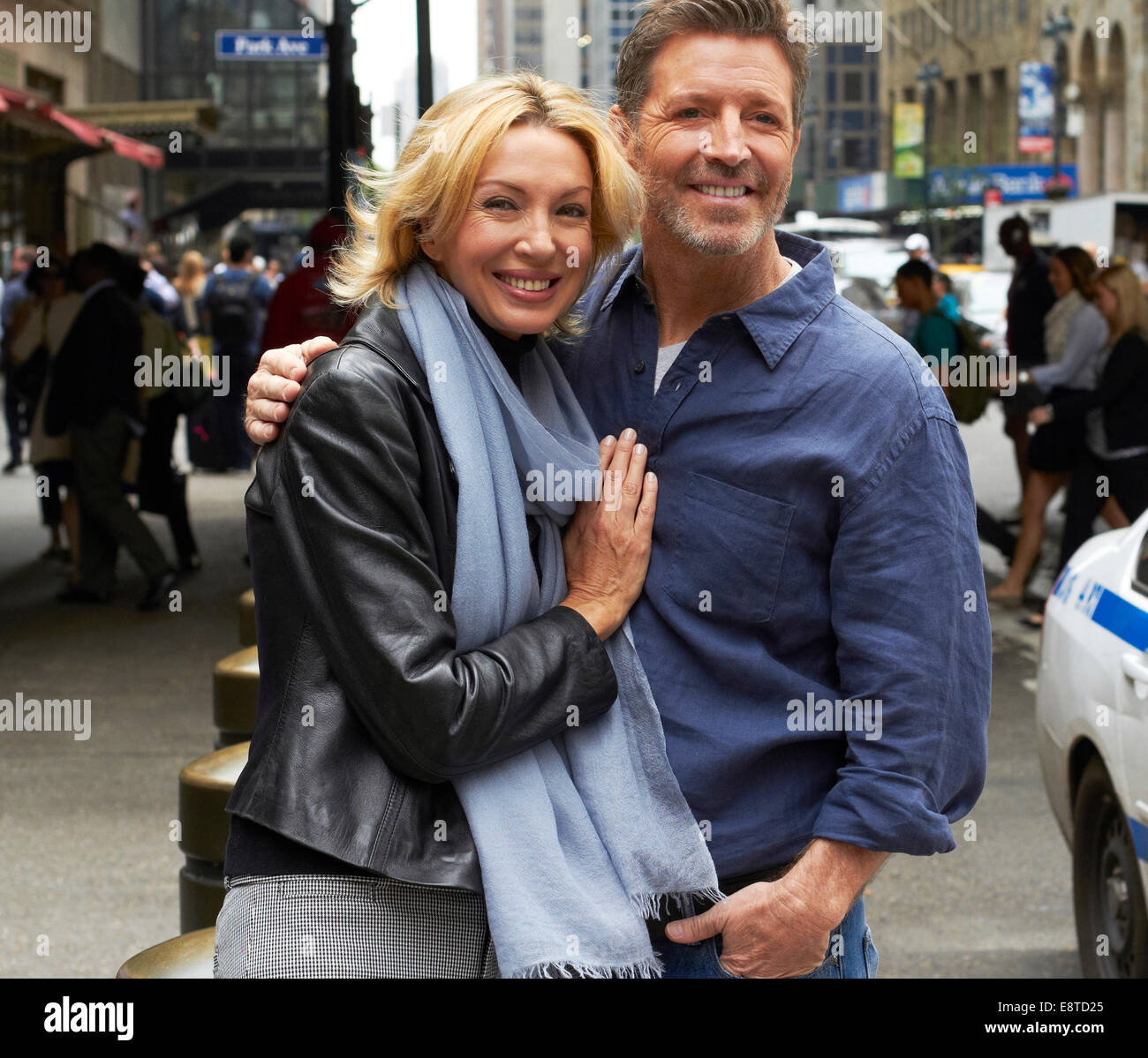 Caucasian couple hugging on city street, New York City, New York, United States Stock Photo