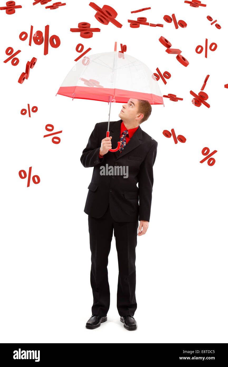Business man with umbrella, under falling big percents signs Stock Photo
