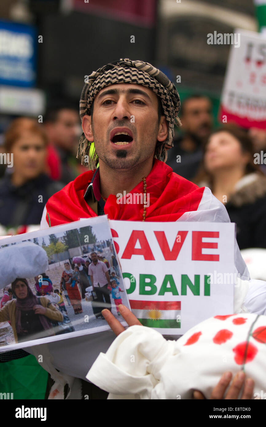 'Save Kobane' & Protect humanity protesters; A protest march  through Liverpool city centre to demonstrate against terrorist group ISIS. Around 300 Kurdish people marched along Church Street, Bold Street and Renshaw Street before picketing outside Lime St Station. Sabiha Soylu took part in the march because she feels more needs to be done to help Kurdish fighters - who are battling with heavily-armed ISIS mililtants. Stock Photo