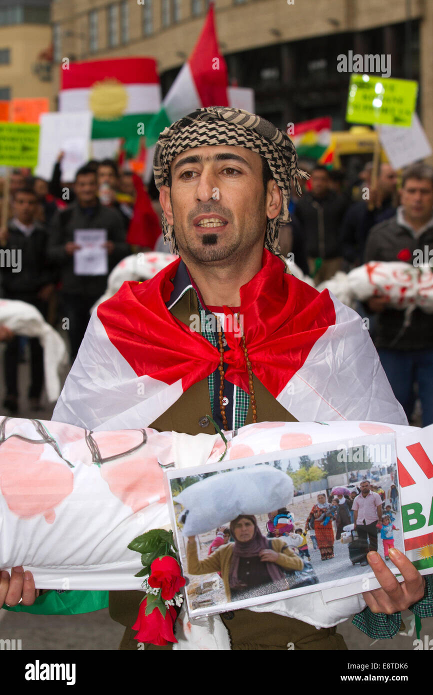 'Save Kobane' & Protect humanity protesters; A protest march  through Liverpool city centre to demonstrate against terrorist group ISIS. Around 300 Kurdish people marched along Church Street, Bold Street and Renshaw Street before picketing outside Lime St Station. Sabiha Soylu took part in the march because she feels more needs to be done to help Kurdish fighters - who are battling with heavily-armed ISIS mililtants. Stock Photo