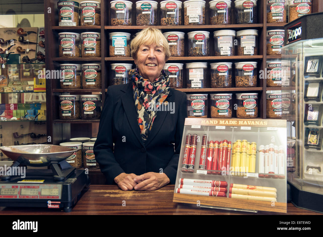 a female tobacconist lady sells, tobacco, cigarettes, loose tobacco
