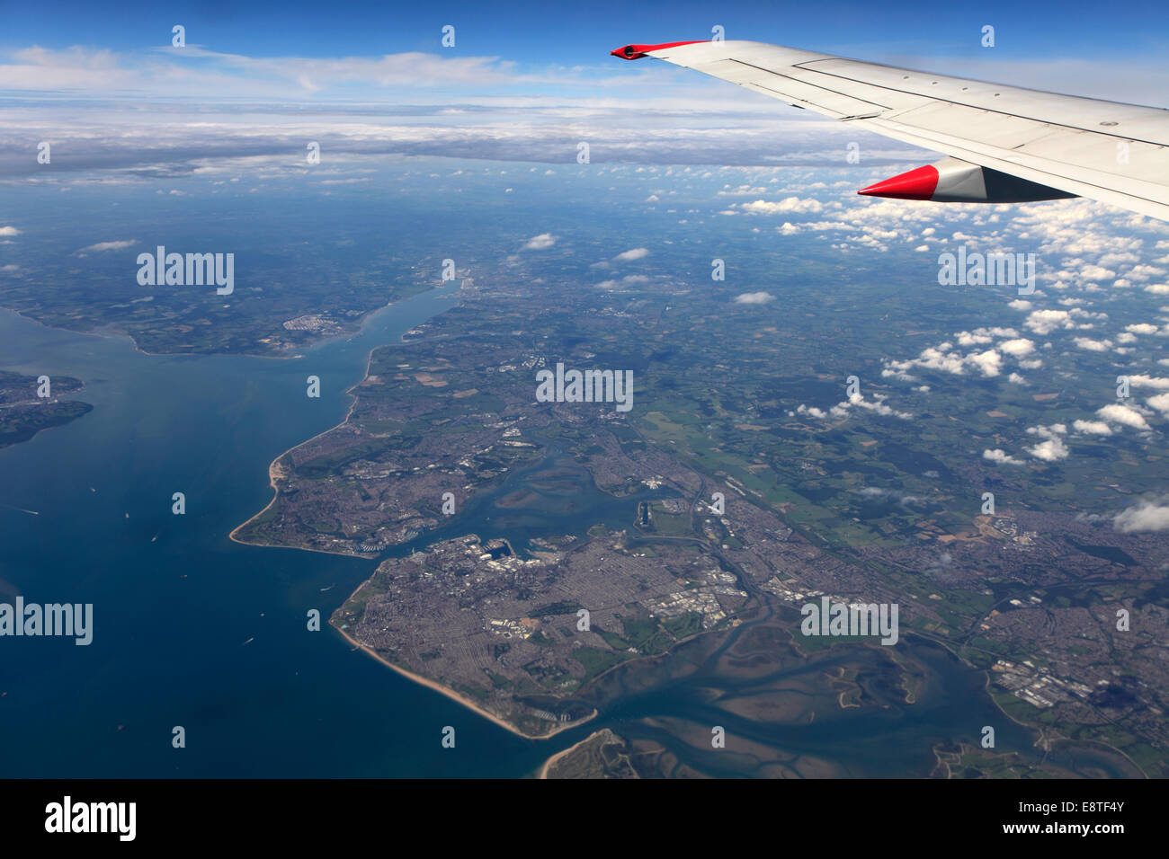 View from aeroplane window of the Solent, Portsmouth and Southampton coastlines, Hampshire, England, UK Stock Photo