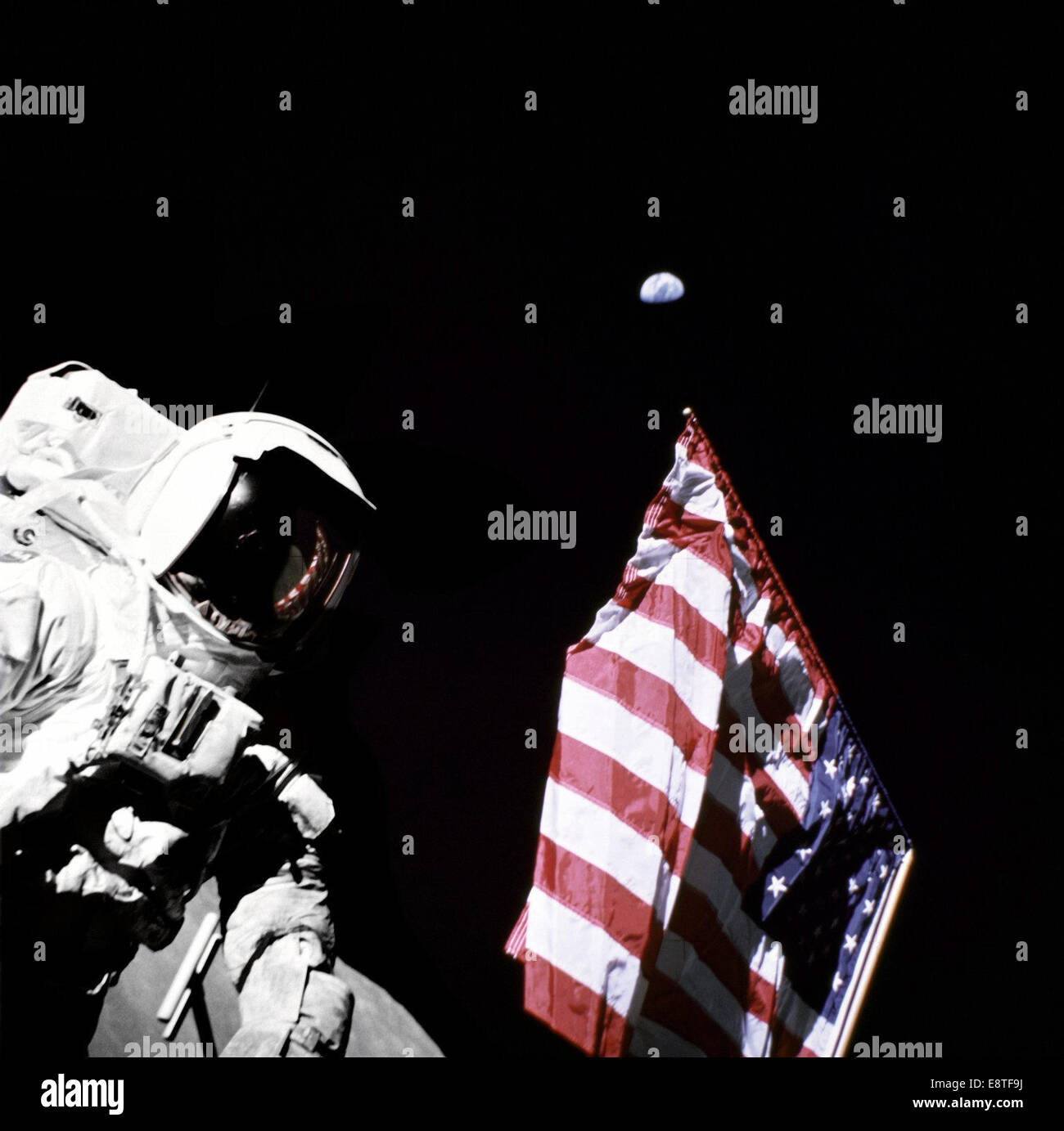 Geologist-Astronaut Harrison Schmitt, Apollo 17 Lunar Module pilot, is photographed next to the American Flag during extravehicular activity (EVA) of NASA's final lunar landing mission in the Apollo series. The photo was taken at the Taurus-Littrow landin Stock Photo