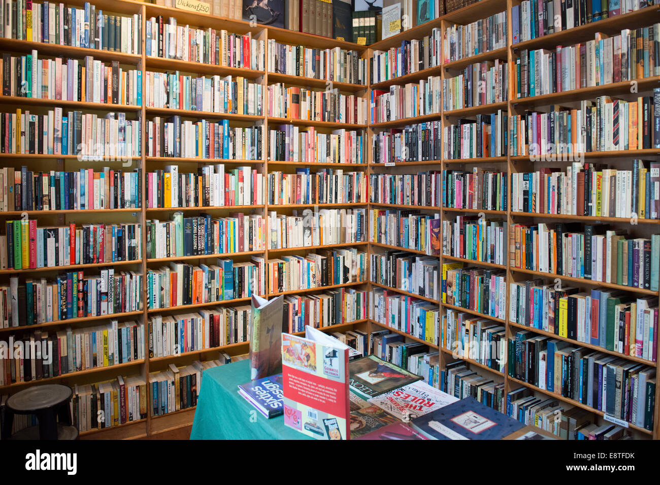 shelves in a second hand book shop filled with books and more books on display Stock Photo