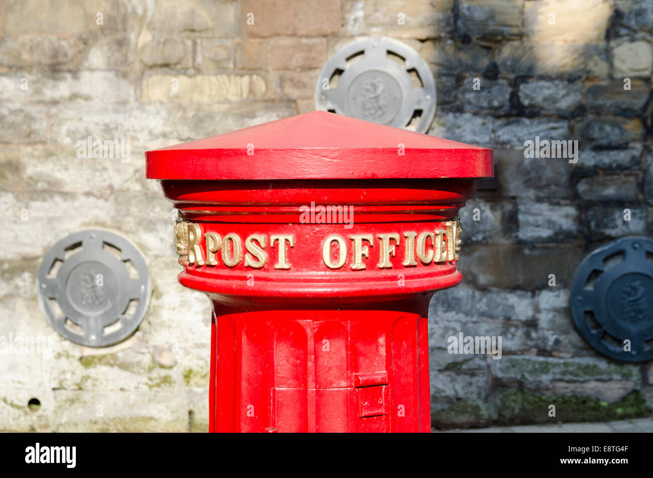 Top of a bright red old-fashioned Post Office letter box in the historic town of Warwick Stock Photo