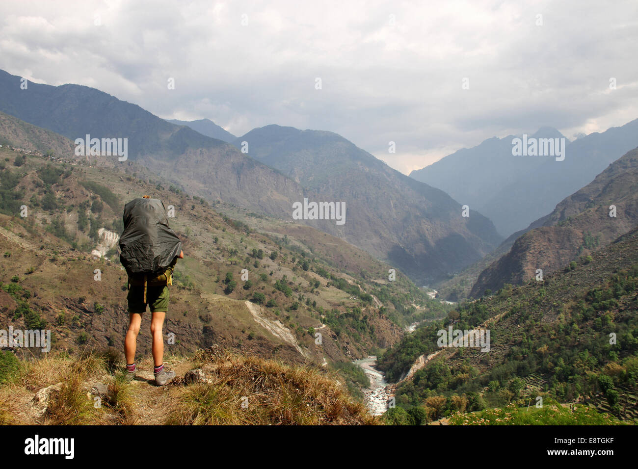 Girl Looks out over Marshyangdi Valley, on Annapurna Circuit, Nepal Stock Photo