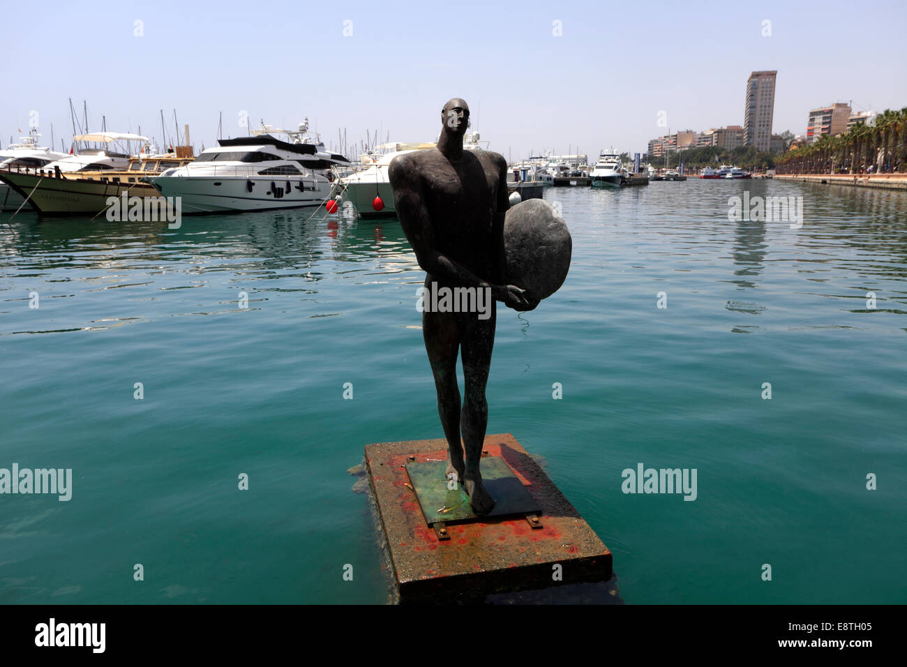 Sculpture by Esperanza dOrs, return of Ikarus with a surf board, port area of Alicante city, capital of Valencia region, Spain, Stock Photo