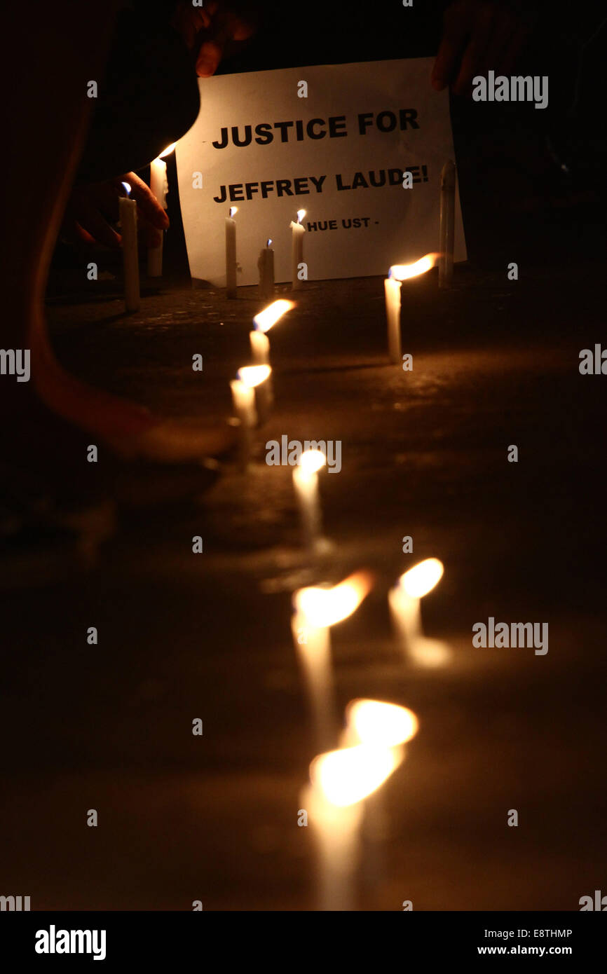 Manila, Philippines. 14th Oct, 2014. Activists light candles during a candlelighting rally in Manila, Philippines on Oct. 14, 2014. The Philippine government on Tuesday vowed justice for a Filipino transgender who was found dead in a hotel in Olongapo City in northern Philippines. A U.S. Marine, identified as Private First Class Joseph Scott Pemberton, was tagged as a possible suspect in the murder of Jeffrey Laude. Credit:  Rouelle Umali/Xinhua/Alamy Live News Stock Photo