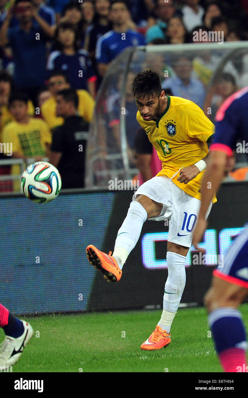 Singapore. 14th Oct, 2014. Brazil's Neymar kicks the ball during the friendly soccer match against Japan in Singapore's National Stadium on Oct. 14, 2014. Japan lost 0-4. Credit:  Then Chih Wey/Xinhua/Alamy Live News Stock Photo