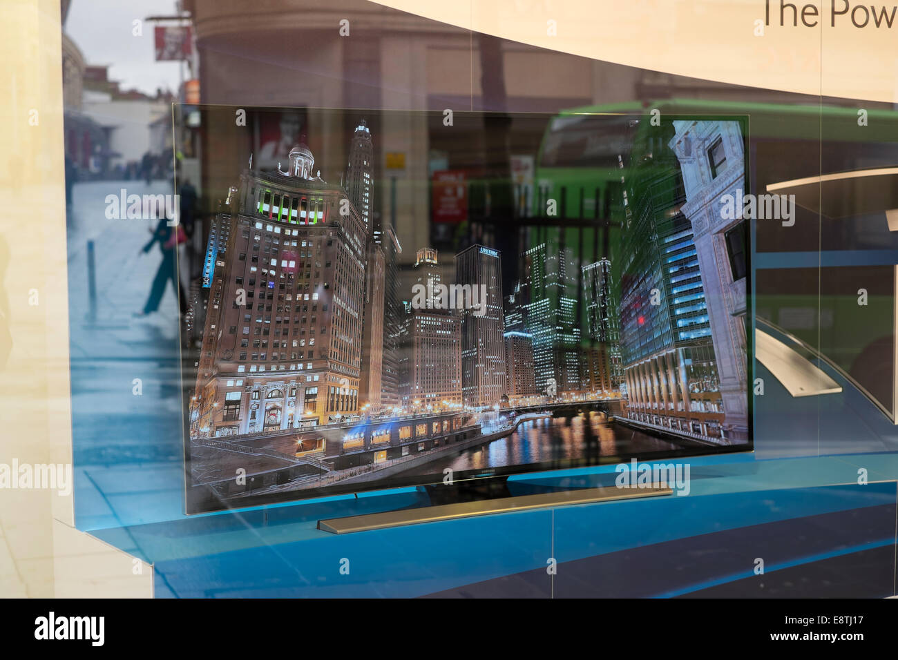 Curved Wide Screen TV In Shop Window . Stock Photo