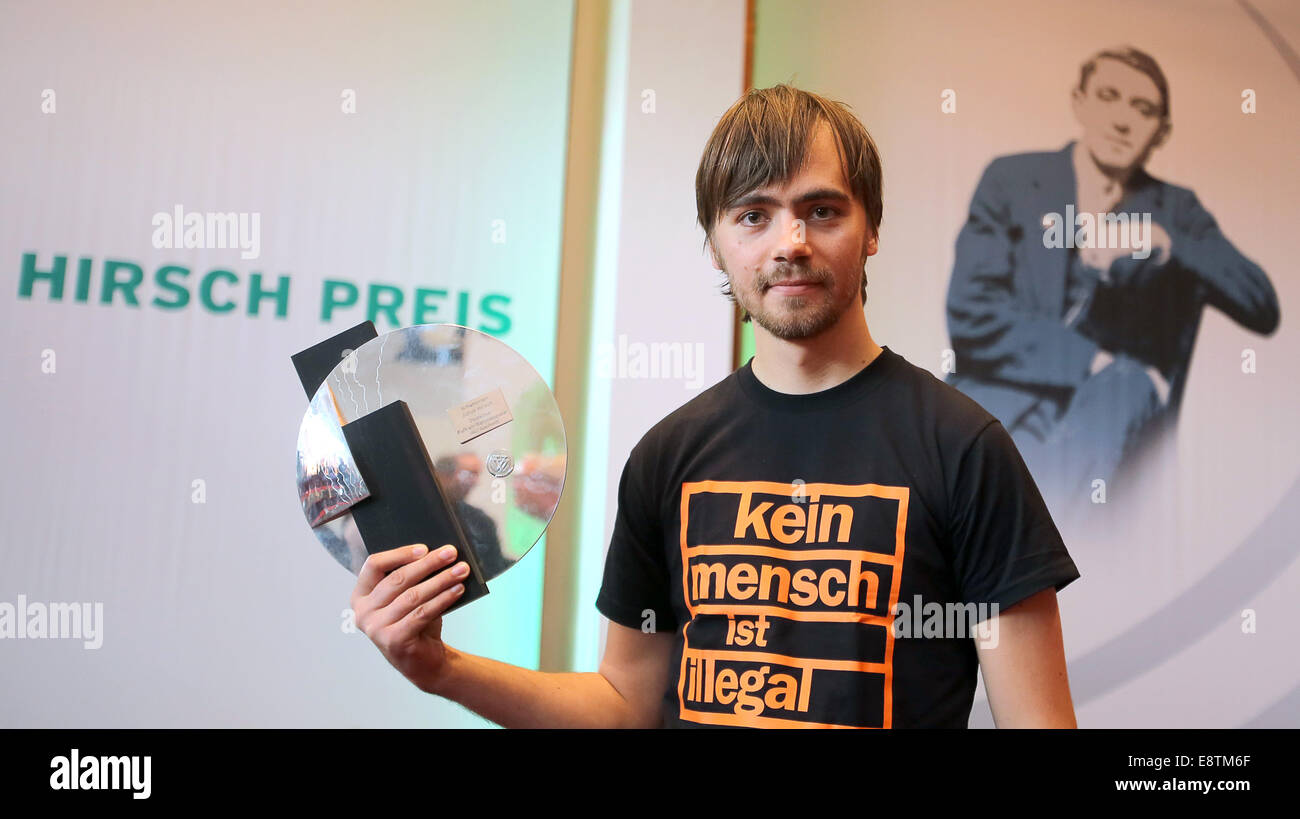 Gelsenkirchen, Germany. 14th Oct, 2014. Simon Mueller (R) from FC Bayern Munich's fan club 'Schickeria' is awarded the Julius Hirsch Award from the German Football Association (DFB) at Hans-Sachs-Haus in Gelsenkirchen, Germany, 14 October 2014. The DFB honors people and institutions with the Julius Hirsch Award for their committment to freedom, tolerance and philanthropy. Photo: FREDRIK VON ERICHSEN/dpa/Alamy Live News Stock Photo