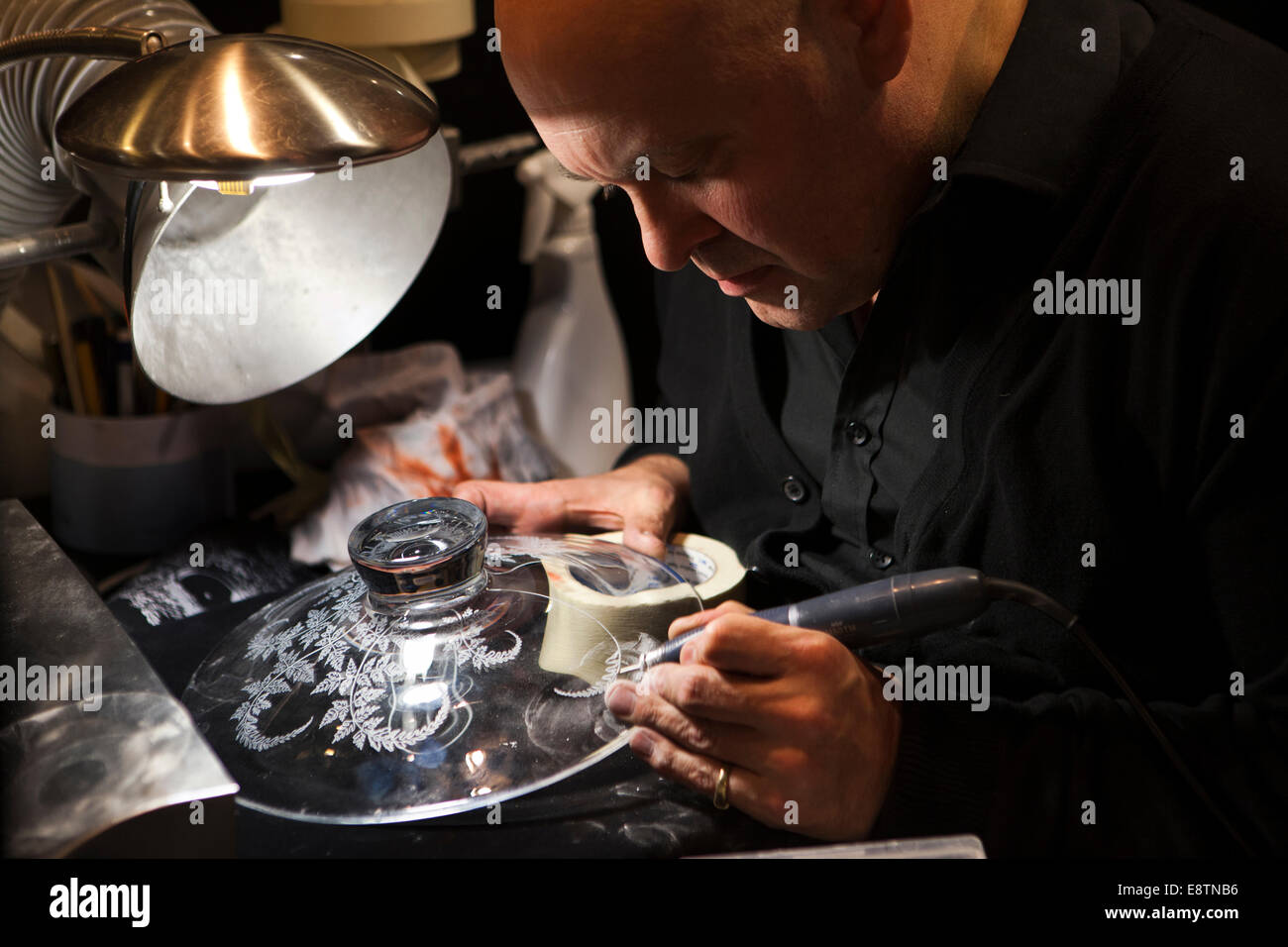 UK, England, Devon, Great Torrington, Dartington Crystal factory, Nick Davy engraving bowl Stock Photo