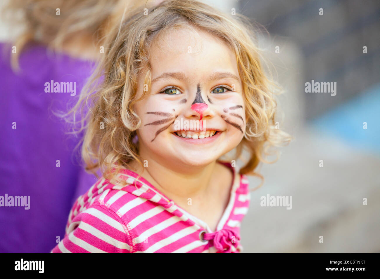 Face paint on young girl at a party. Stock Photo