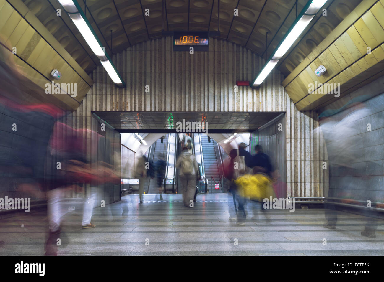 fast moving people at subway train station, long exposure image Stock Photo