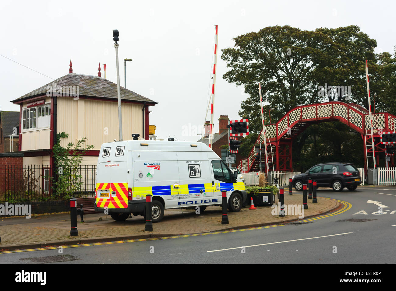 Oakham, Rutland, UK. 14th October, 2014. British Transport Police camera van monitors Oakham town rail crossing Rutland, England, UK.. The crossing has the 3rd highest number of driving offences in the country where drivers risk lives by driving through the crossing barriers when the stop lights are flashing. Credit:  Jim Harrison/Alamy Live News Stock Photo