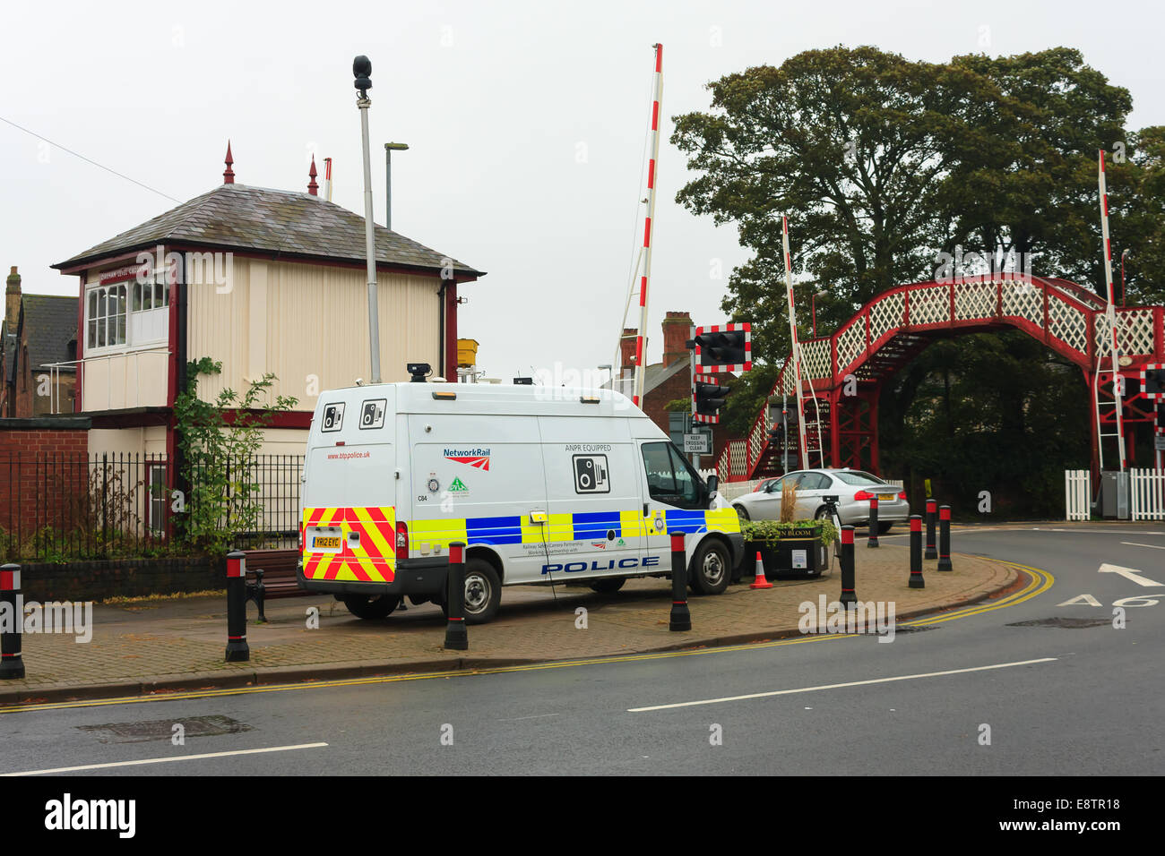 Oakham, Rutland, UK. 14th October, 2014. British Transport Police camera van monitors Oakham town rail crossing Rutland, England, UK.. The crossing has the 3rd highest number of driving offences in the country where drivers risk lives by driving through the crossing barriers when the stop lights are flashing. Credit:  Jim Harrison/Alamy Live News Stock Photo