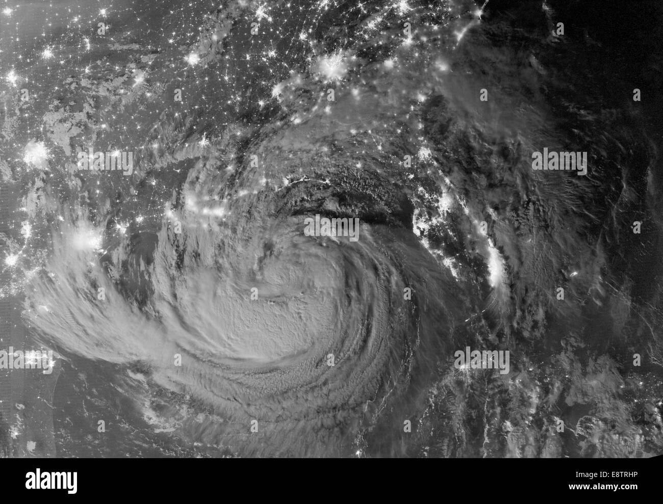 NASA image acquired August 28, 2012 Early on August 28, 2012, the Visible Infrared Imaging Radiometer Suite (VIIRS) on the Suomi-NPP satellite captured this nighttime view of Tropical Storm Isaac and the cities near the Gulf Coast of the United States. Th Stock Photo