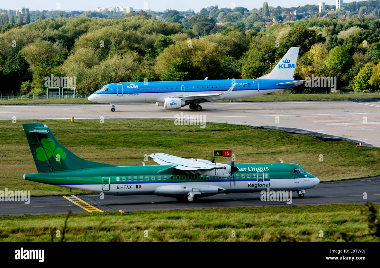 Aer Lingus ATR-72 and KLM Cityhopper Embraer ERJ-190 at Birmingham Airport, UK Stock Photo