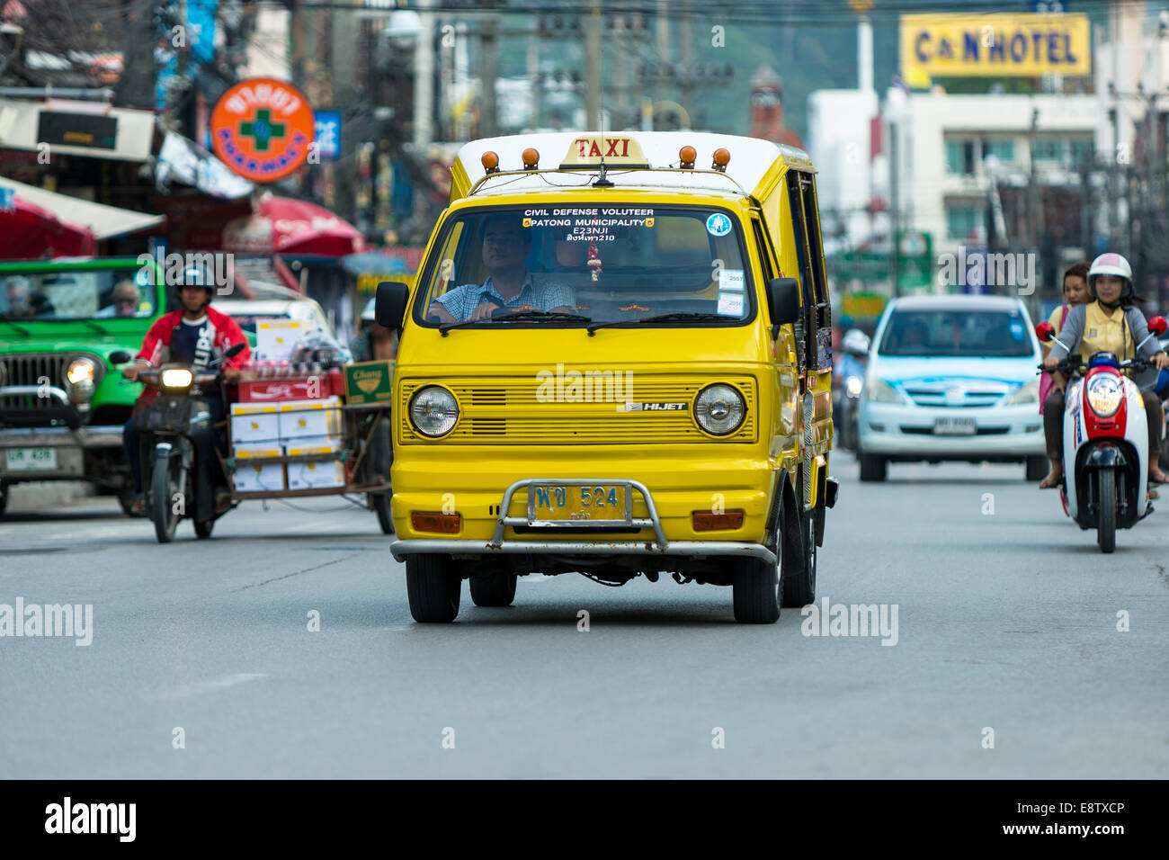 Tuk-tuk moto taxi on the street on January 1, 2014 in Phuket, Thailand. Famous thai moto-taxi called tuk-tuk is a landmark Stock Photo