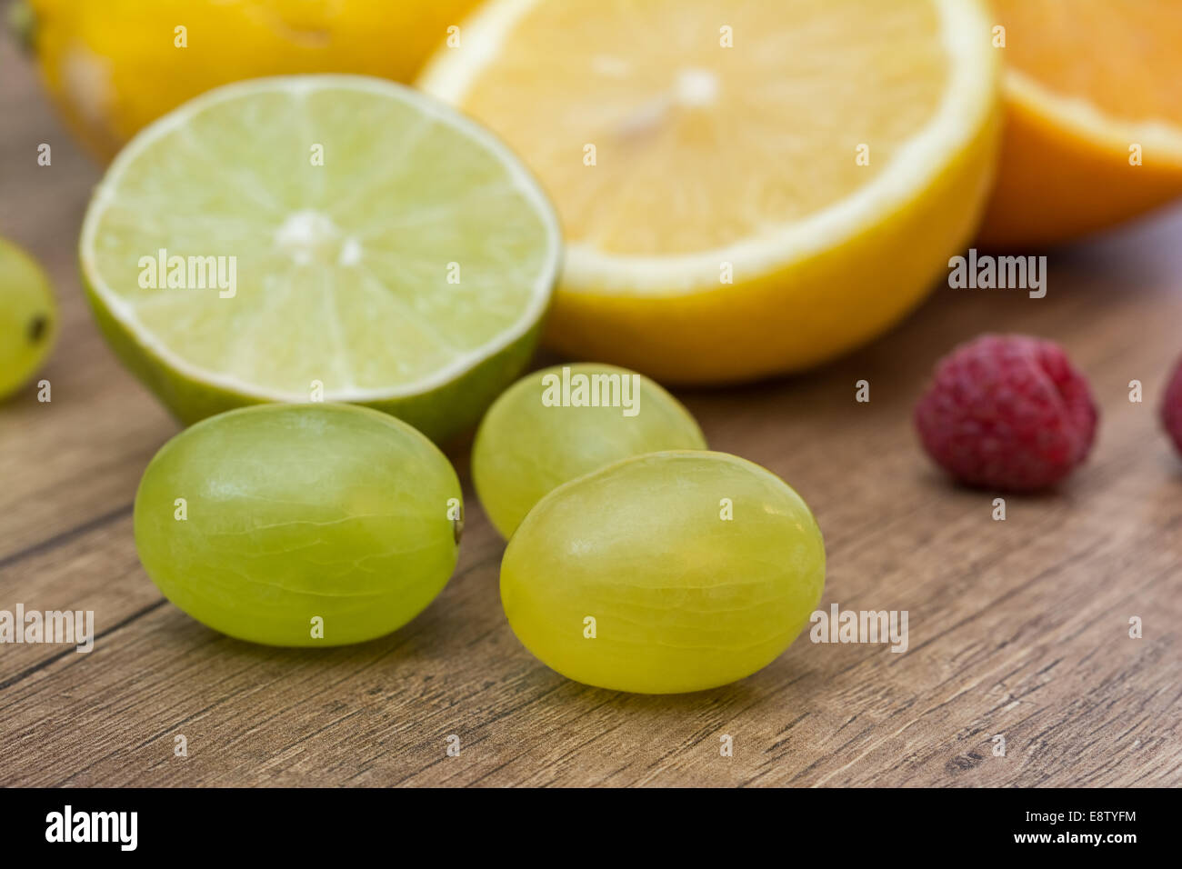 Assortment Of Fresh Exotic Fruits On Wood Table Stock Photo - Alamy